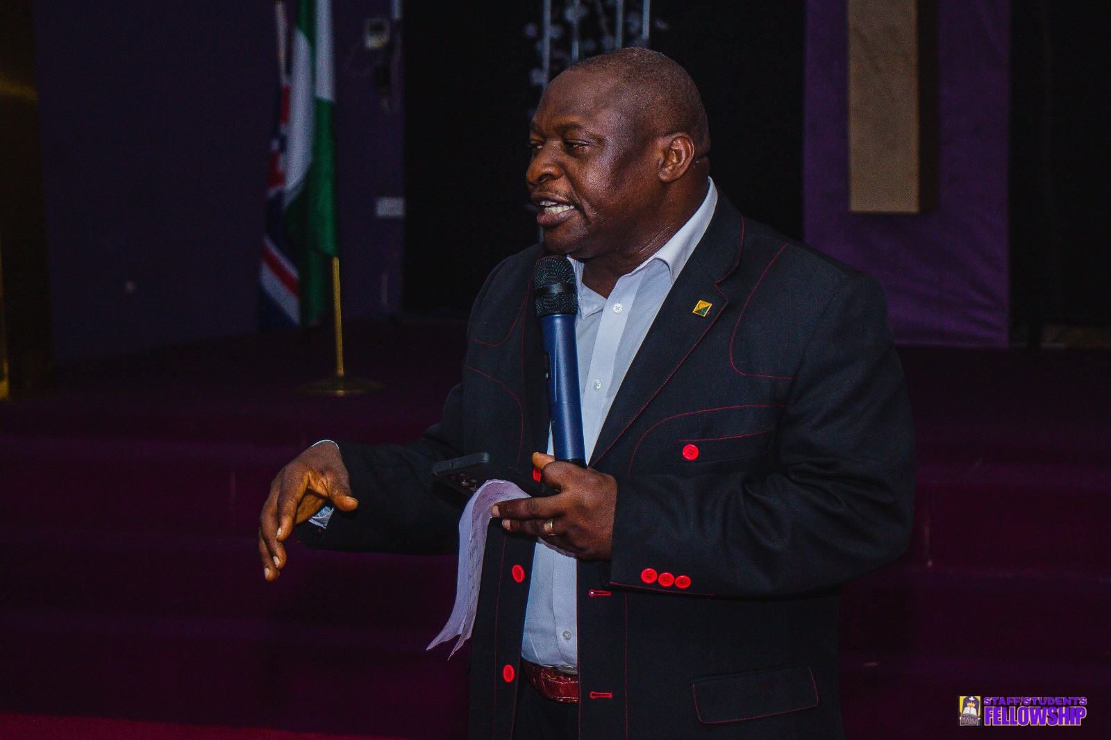 Staff member addressing Monarch University students