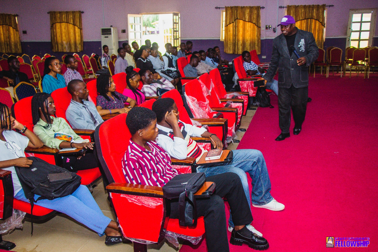 Speaker addressing Monarch University students